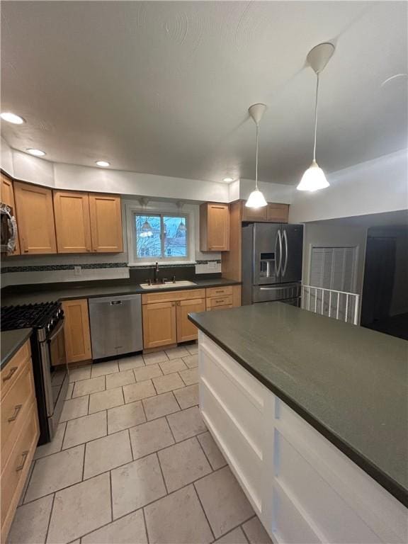 kitchen with tasteful backsplash, stainless steel appliances, sink, light tile patterned floors, and decorative light fixtures