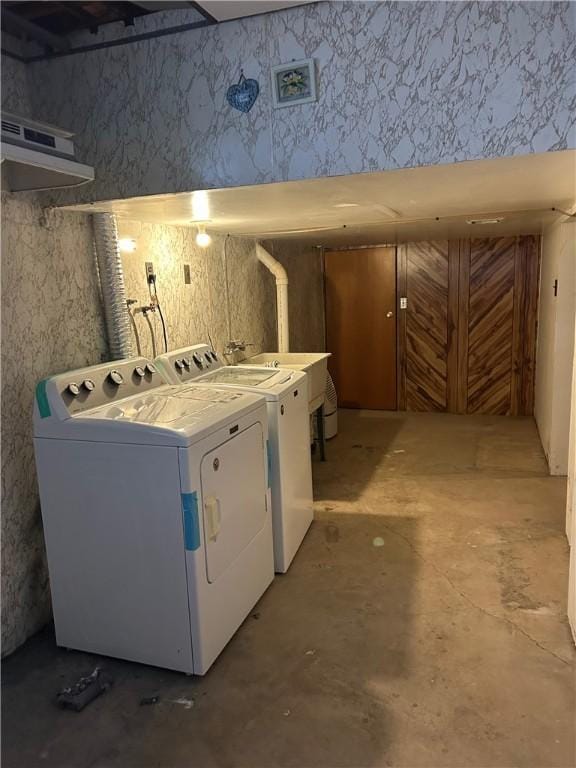 washroom featuring washer and dryer and sink