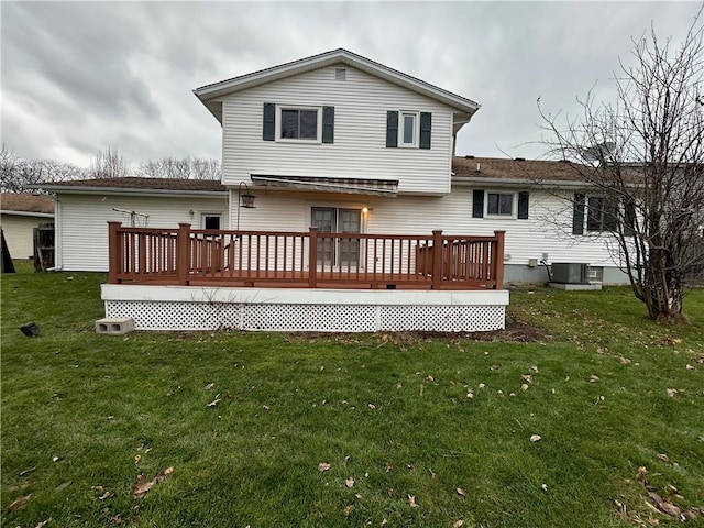 back of property with a yard, central AC, and a wooden deck