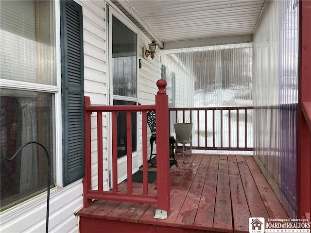 wooden deck featuring covered porch