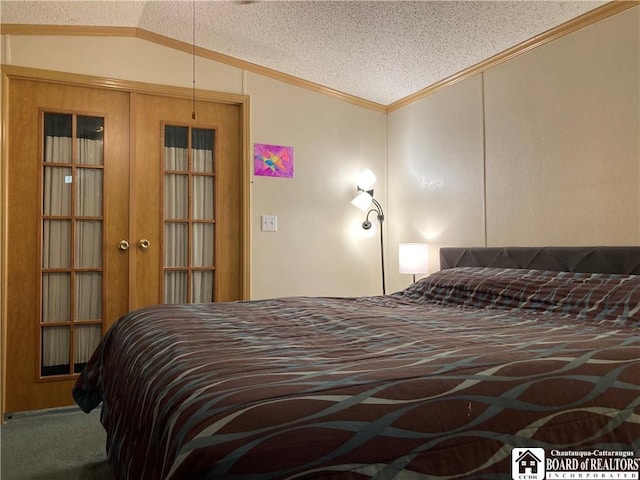 carpeted bedroom featuring crown molding, lofted ceiling, a textured ceiling, and french doors