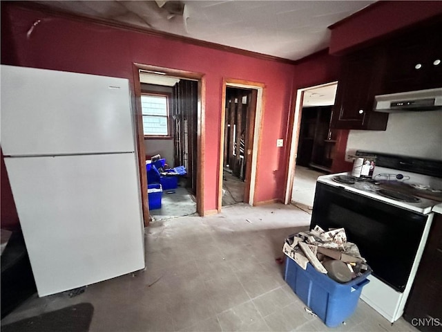 kitchen featuring range hood and white appliances