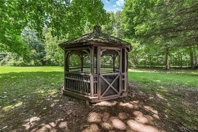 exterior space featuring a gazebo and a yard