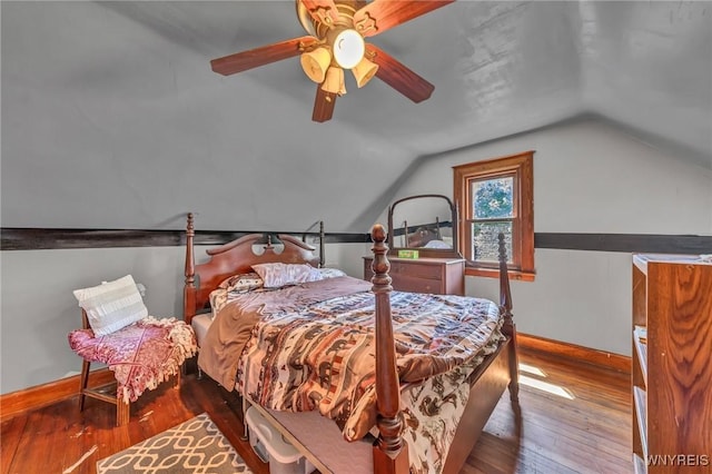 bedroom featuring hardwood / wood-style flooring, ceiling fan, and vaulted ceiling