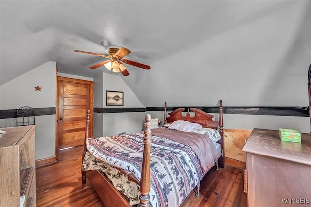 bedroom with vaulted ceiling, ceiling fan, and dark hardwood / wood-style floors