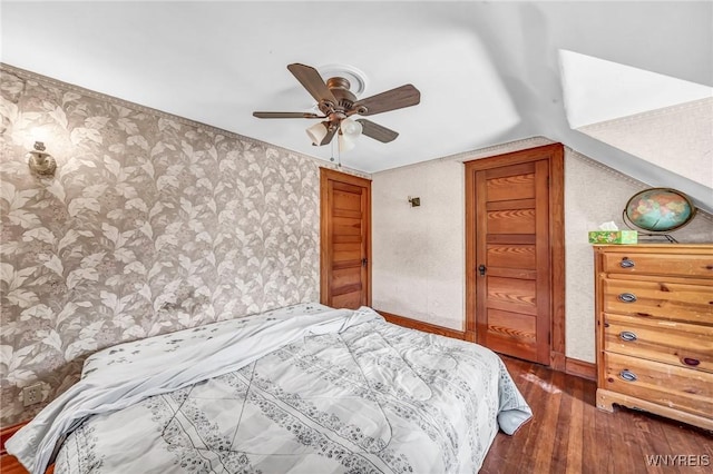 bedroom featuring ceiling fan and dark hardwood / wood-style floors