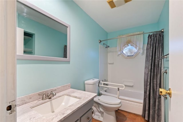 full bathroom featuring shower / bath combo, vanity, and toilet