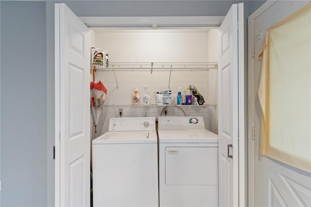 laundry room featuring separate washer and dryer