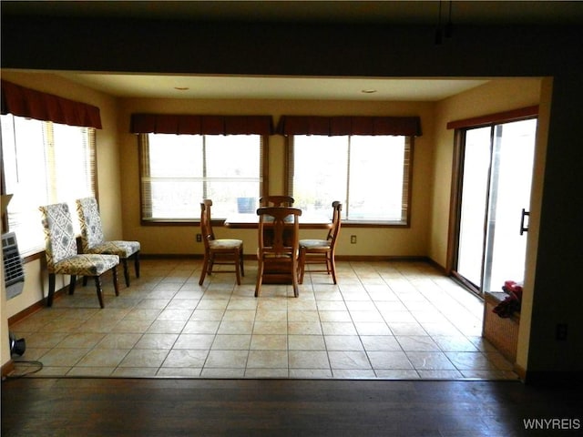 dining area featuring tile patterned flooring