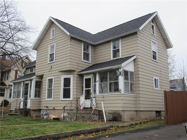 view of front property featuring a sunroom