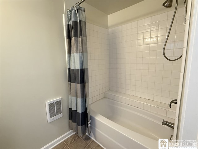 bathroom with tile patterned floors and shower / tub combo with curtain