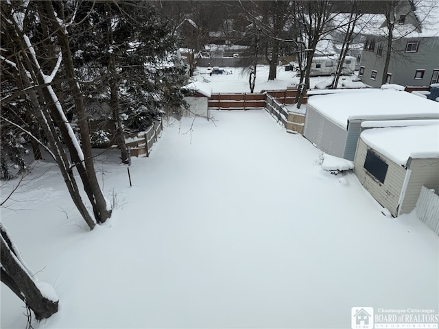 view of yard layered in snow