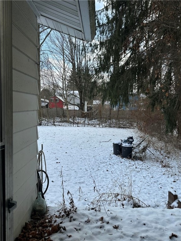 view of yard layered in snow