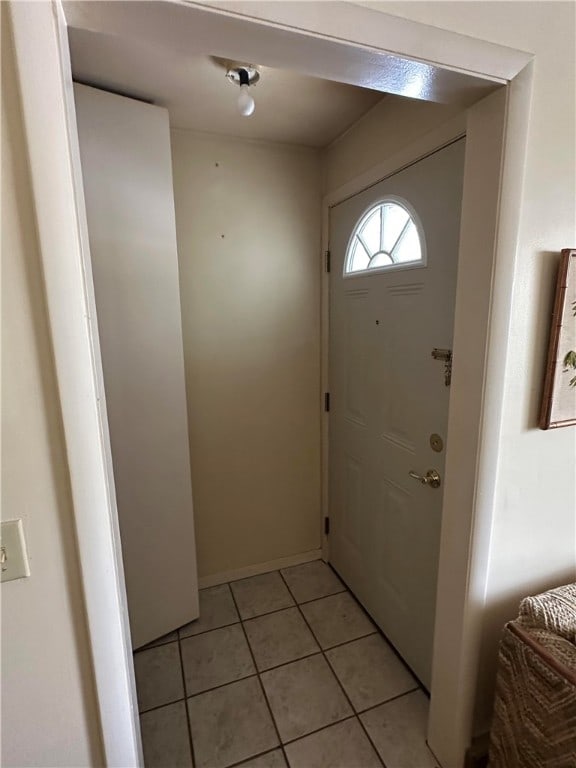 entryway featuring light tile patterned floors