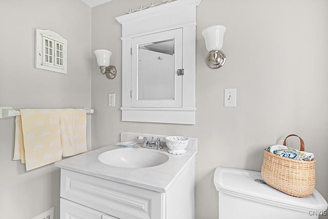 bathroom featuring vanity and toilet