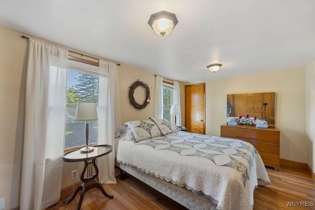 bedroom with wood-type flooring