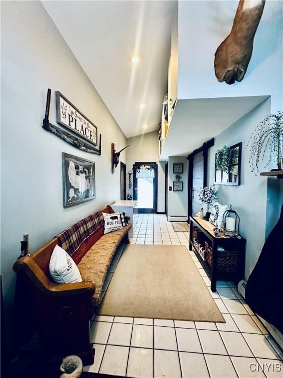 living room featuring light tile patterned floors and vaulted ceiling