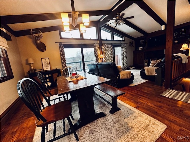 dining space featuring hardwood / wood-style floors, ceiling fan, and vaulted ceiling with beams