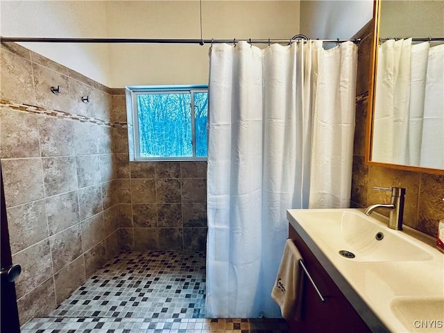 bathroom with vanity and walk in shower