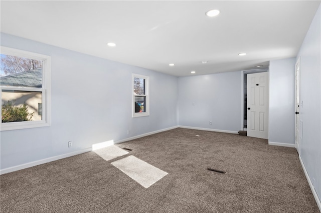 unfurnished room featuring carpet flooring