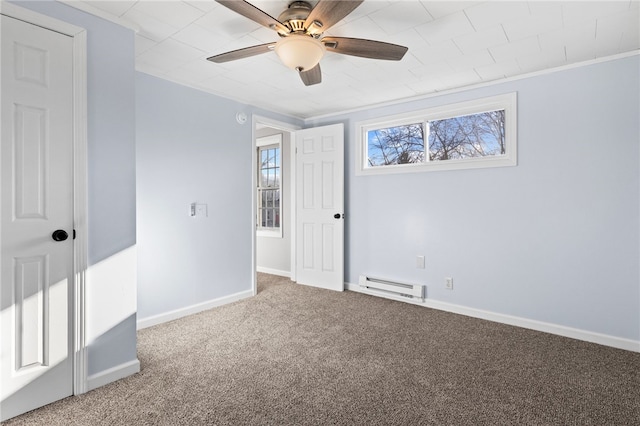 empty room with ceiling fan, carpet floors, crown molding, and a baseboard radiator