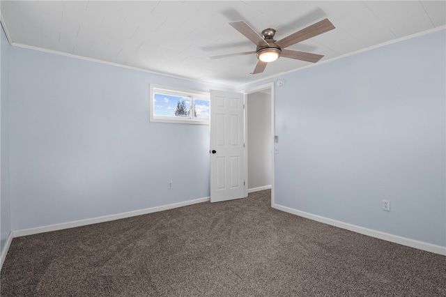 spare room with carpet, ceiling fan, and crown molding