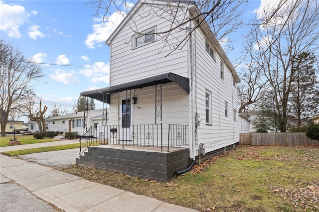 bungalow-style home featuring a front yard