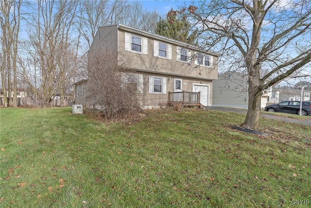 view of front of house with a garage and a front yard