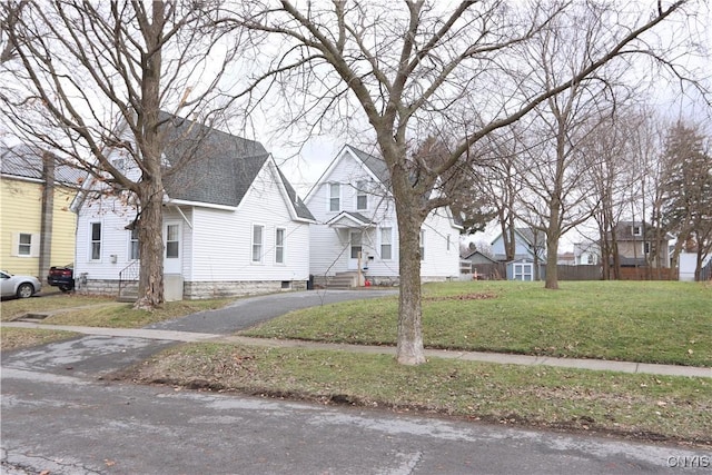 bungalow-style house featuring a front yard