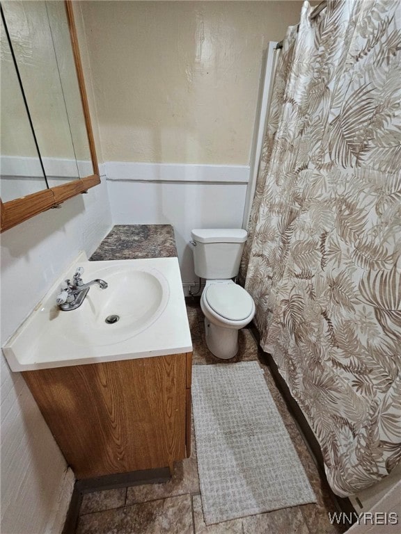 bathroom with toilet and vanity