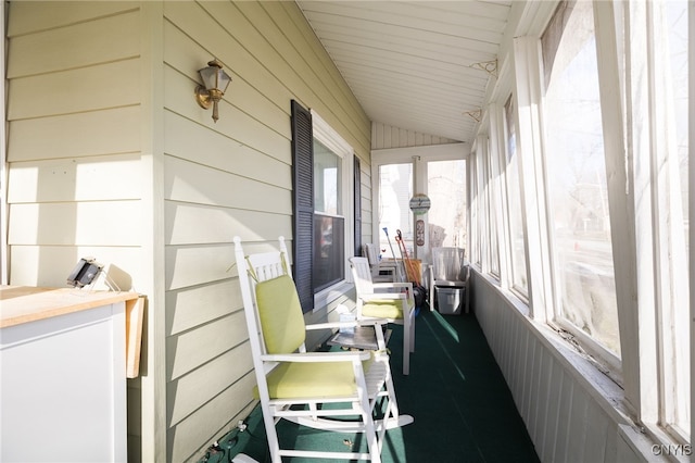 sunroom / solarium with vaulted ceiling