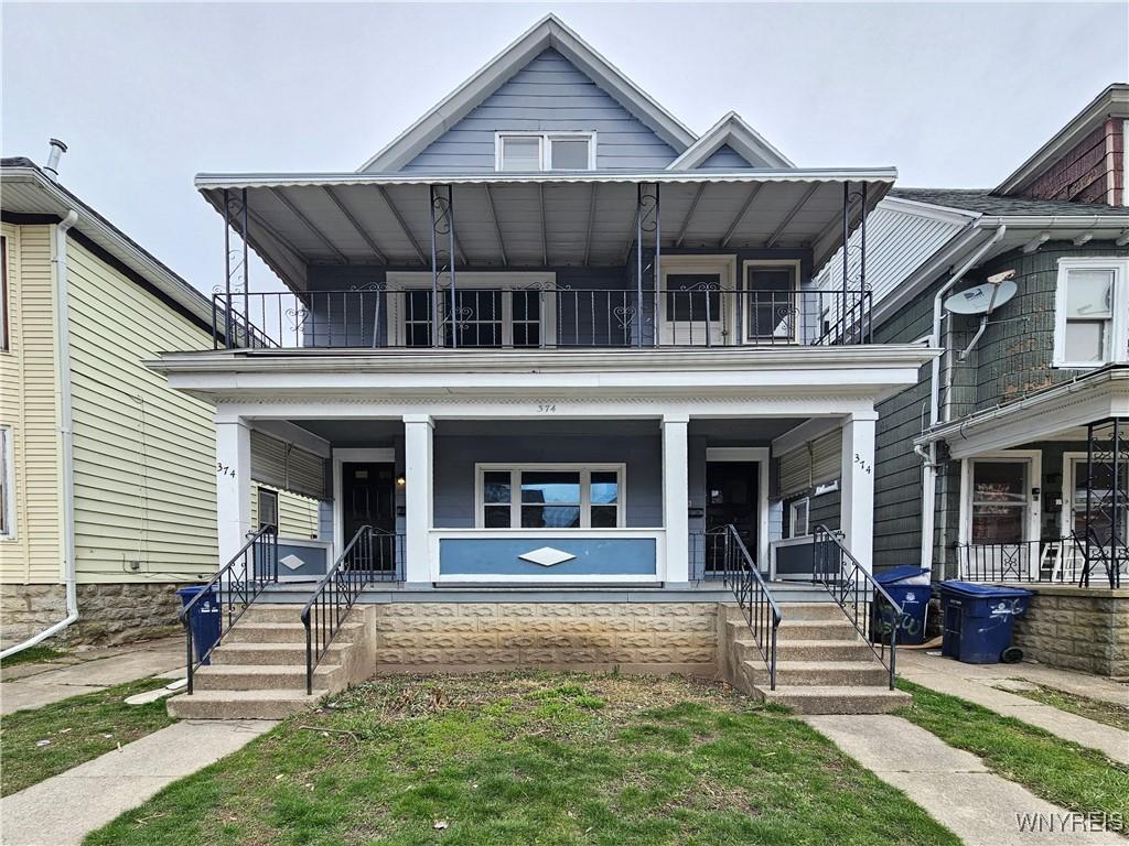 view of front of house featuring covered porch and a balcony