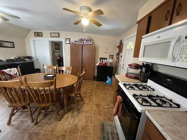 kitchen featuring vaulted ceiling, ceiling fan, and white appliances