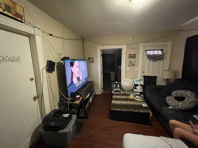 living room with dark hardwood / wood-style floors