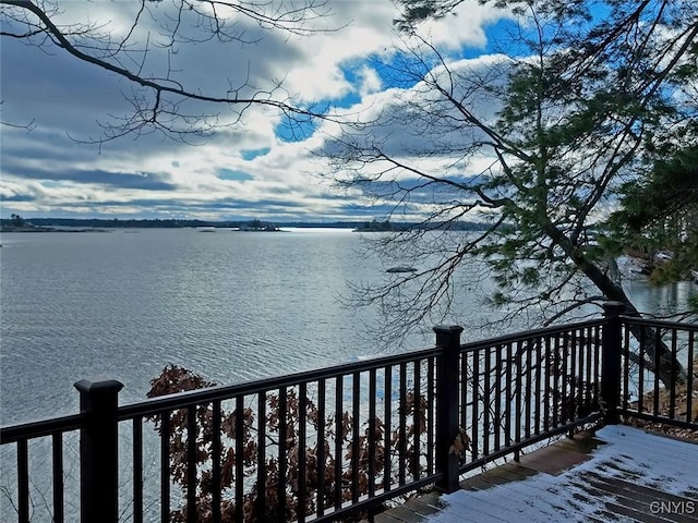 deck featuring a water view