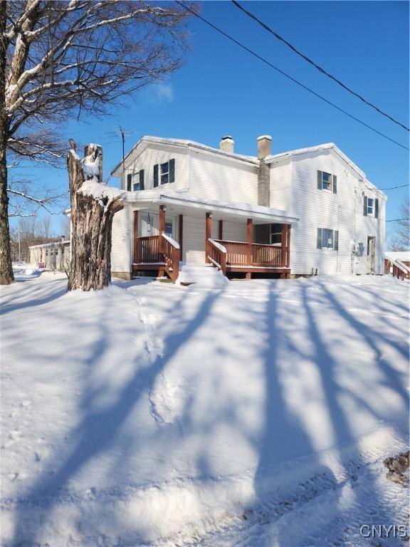 view of snow covered house