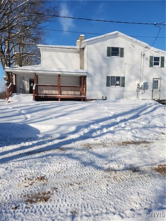 view of snow covered property