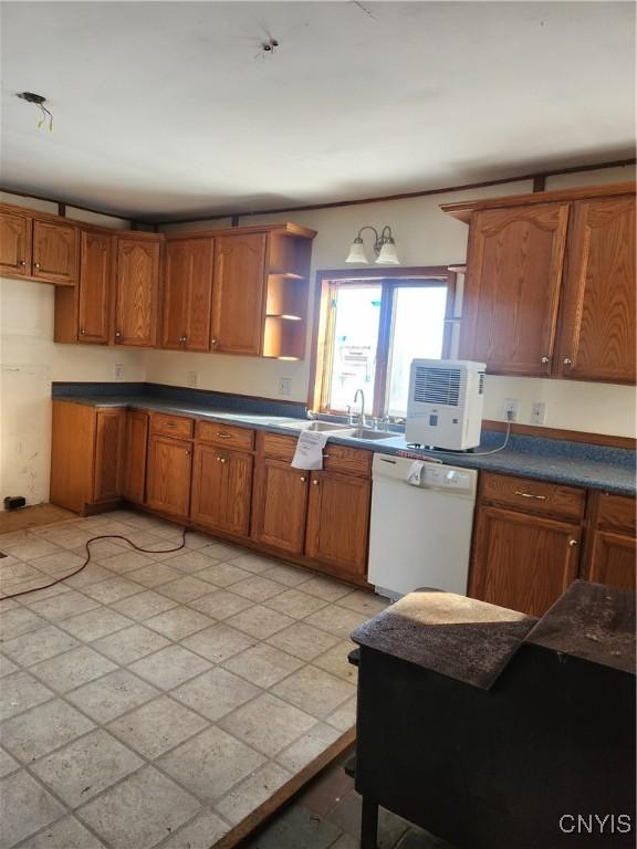 4057 Wilson Rd E, Annsville, NY 13471 - kitchen with white dishwasher, a sink, brown cabinets, and open shelves