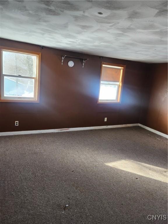 4057 Wilson Rd E, Annsville, NY 13471 - carpeted empty room with baseboards