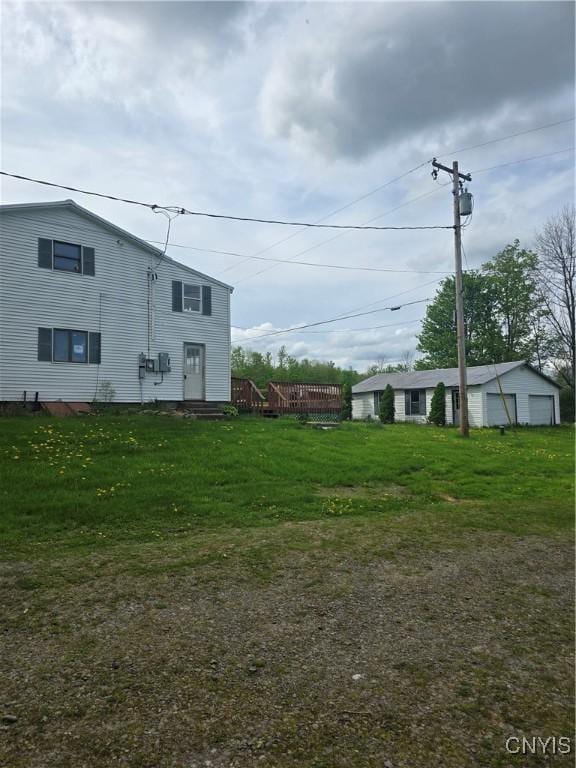 4057 Wilson Rd E, Annsville, NY 13471 - view of grassy yard featuring a garage