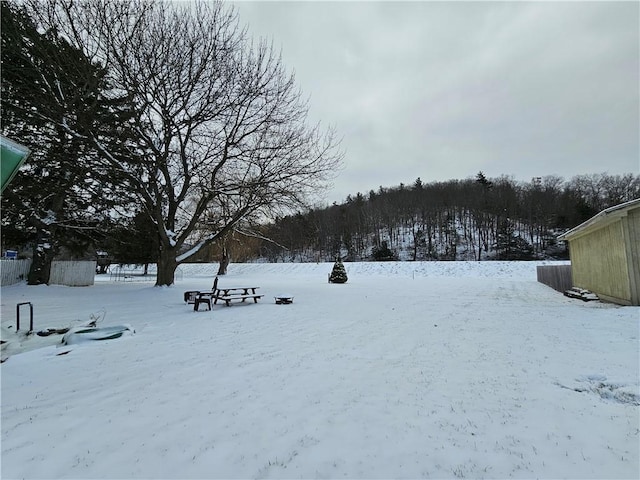 view of yard covered in snow