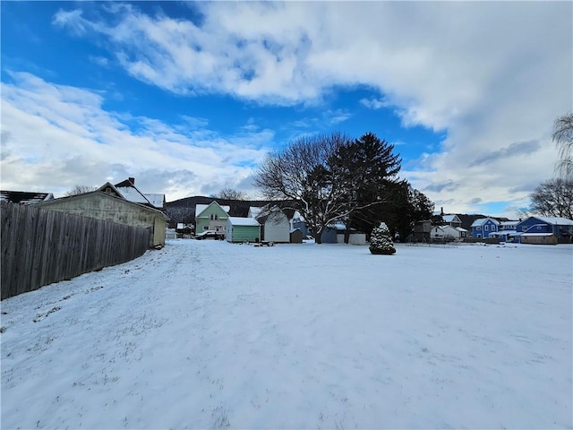 view of yard layered in snow