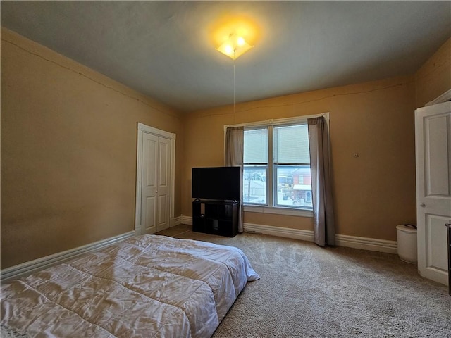 bedroom featuring light carpet