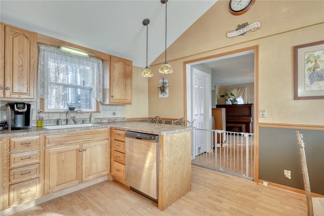 kitchen with kitchen peninsula, backsplash, stainless steel dishwasher, sink, and light brown cabinets