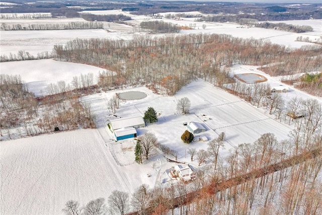 snowy aerial view featuring a rural view