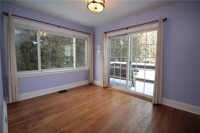 empty room featuring hardwood / wood-style floors