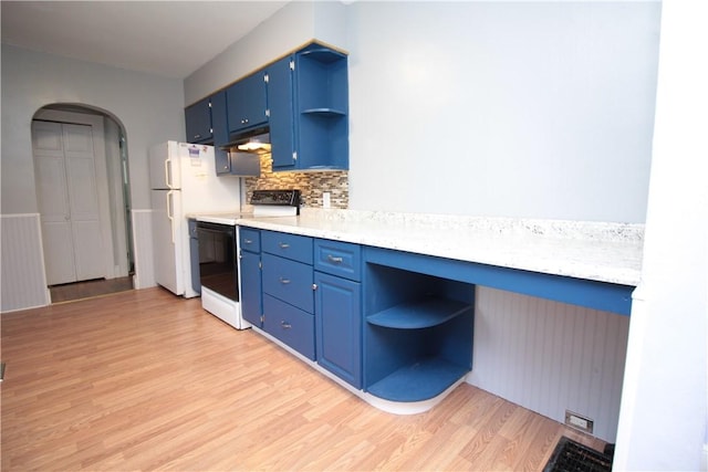 kitchen featuring light wood-type flooring, white appliances, blue cabinets, and backsplash