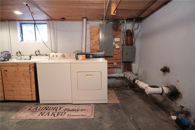 laundry area featuring cabinets, independent washer and dryer, sink, and electric panel