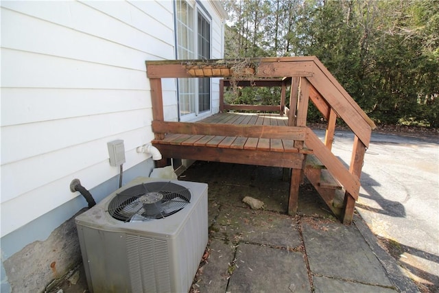 exterior space with a deck and central air condition unit