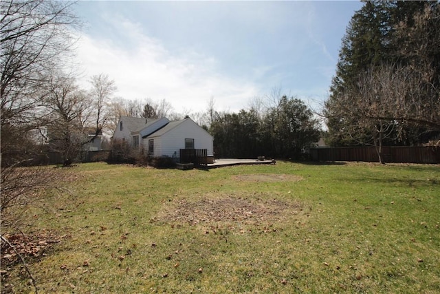 view of yard with a wooden deck and fence